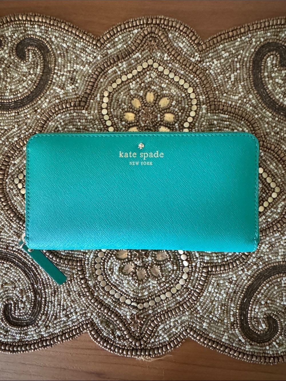 kate spade teal zip-around wallet with gold logo